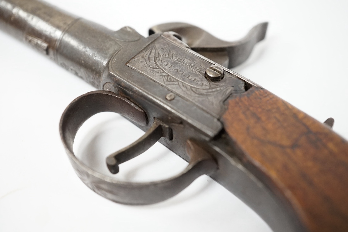 A boxlock percussion pocket pistol, London proved, with turn off barrel, frame signed Whalley within oval upon flag trophy, sliding top thumb safety, slab walnut grip. Condition - fair to good.